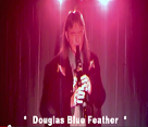 Concert Image of Douglas Blue Feather Playing Flute on Stage